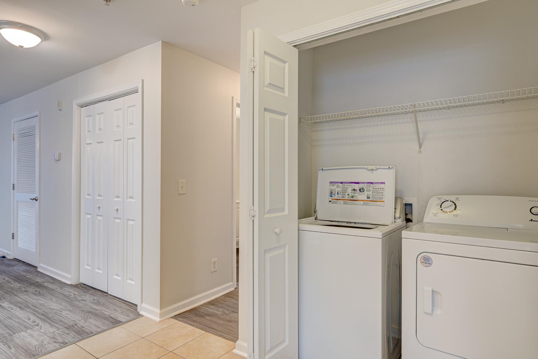 4826 Innisbrook Court, Unit 905 Myrtle Beach, SC 29579 - Photo 5 of 36 Laundry room featuring light tile patterned floors and independent washer and dryer