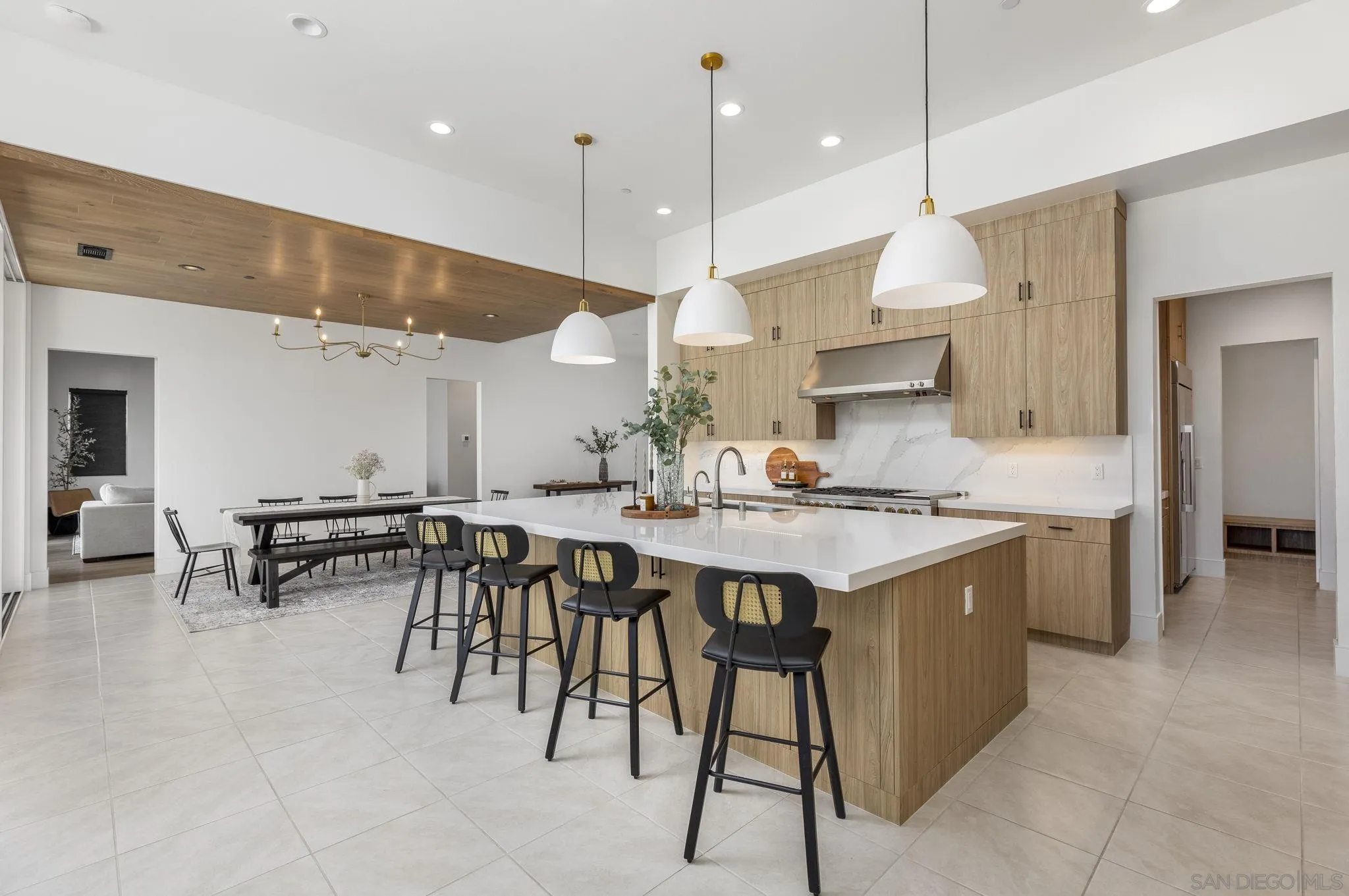32213 Daybrook Terrace Temecula, CA 92591 - Photo 7 of 23 a kitchen with a table chairs microwave and cabinets