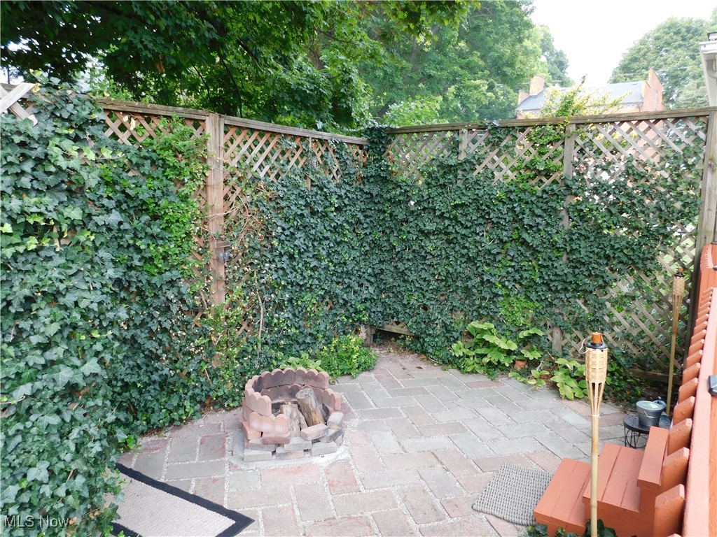 3470 County Line Road Madison, OH 44057 - Photo 11 of 48 View of patio / terrace with an outdoor fire pit
