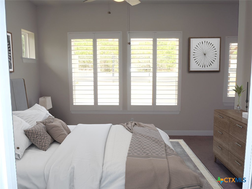 791 Hazy Hills Loop Dripping Springs, TX 78620 - Photo 25 of 44 a bedroom with a bed and a window