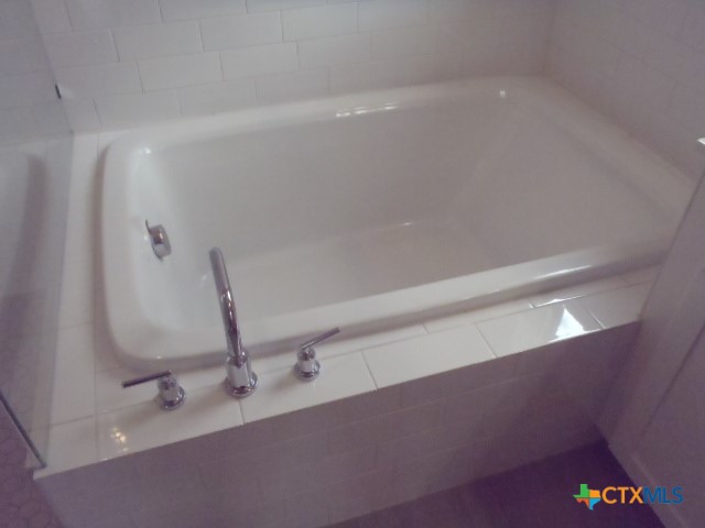 791 Hazy Hills Loop Dripping Springs, TX 78620 - Photo 29 of 44 a bathroom with a sink and a mirror