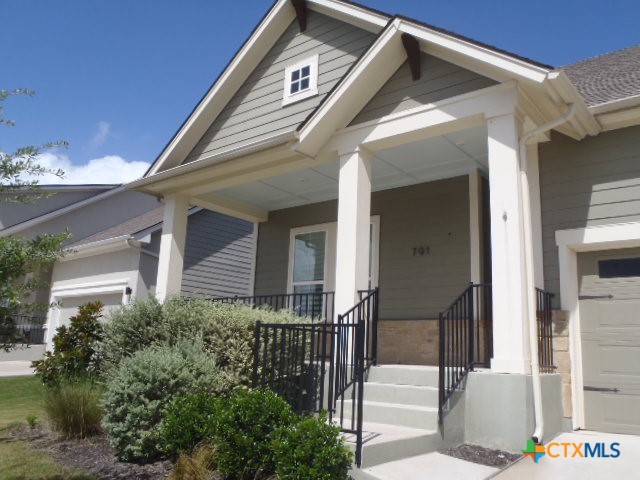 791 Hazy Hills Loop Dripping Springs, TX 78620 - Photo 4 of 44 a view of a house with a small yard