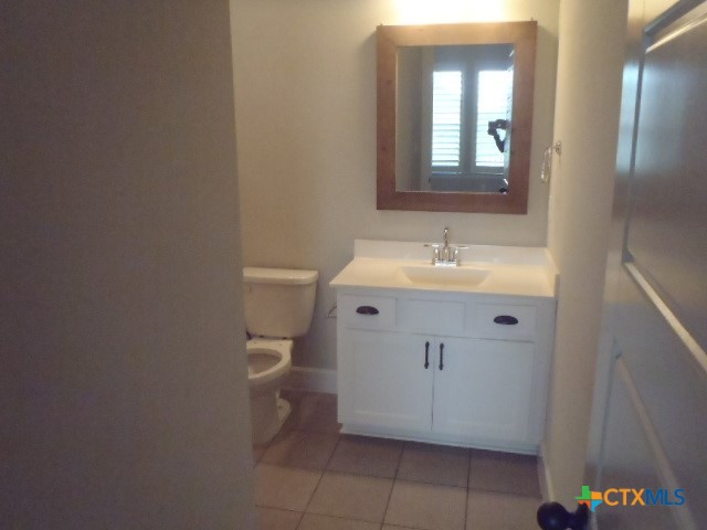 791 Hazy Hills Loop Dripping Springs, TX 78620 - Photo 43 of 44 a bathroom with a sink and a mirror