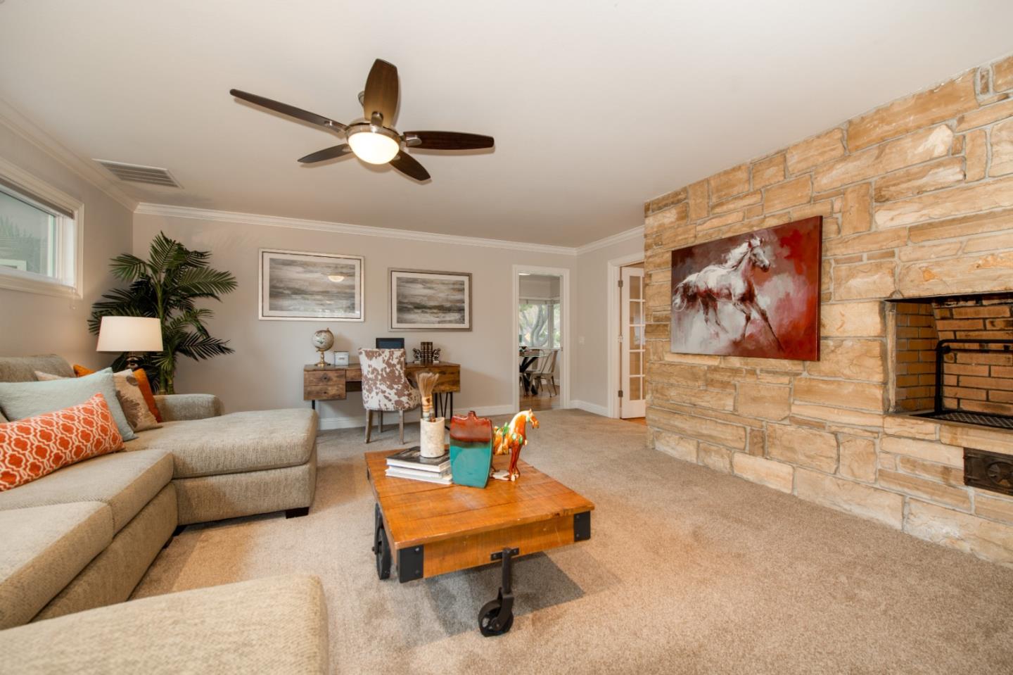 981 Thatcher Drive Los Altos, CA 94024 - Photo 11 of 30 a living room with furniture and a flat screen tv