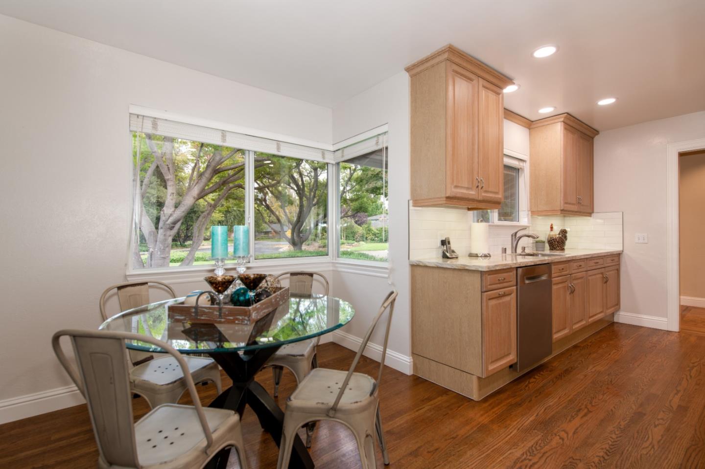 981 Thatcher Drive Los Altos, CA 94024 - Photo 15 of 30 a kitchen with a table chairs sink and cabinets