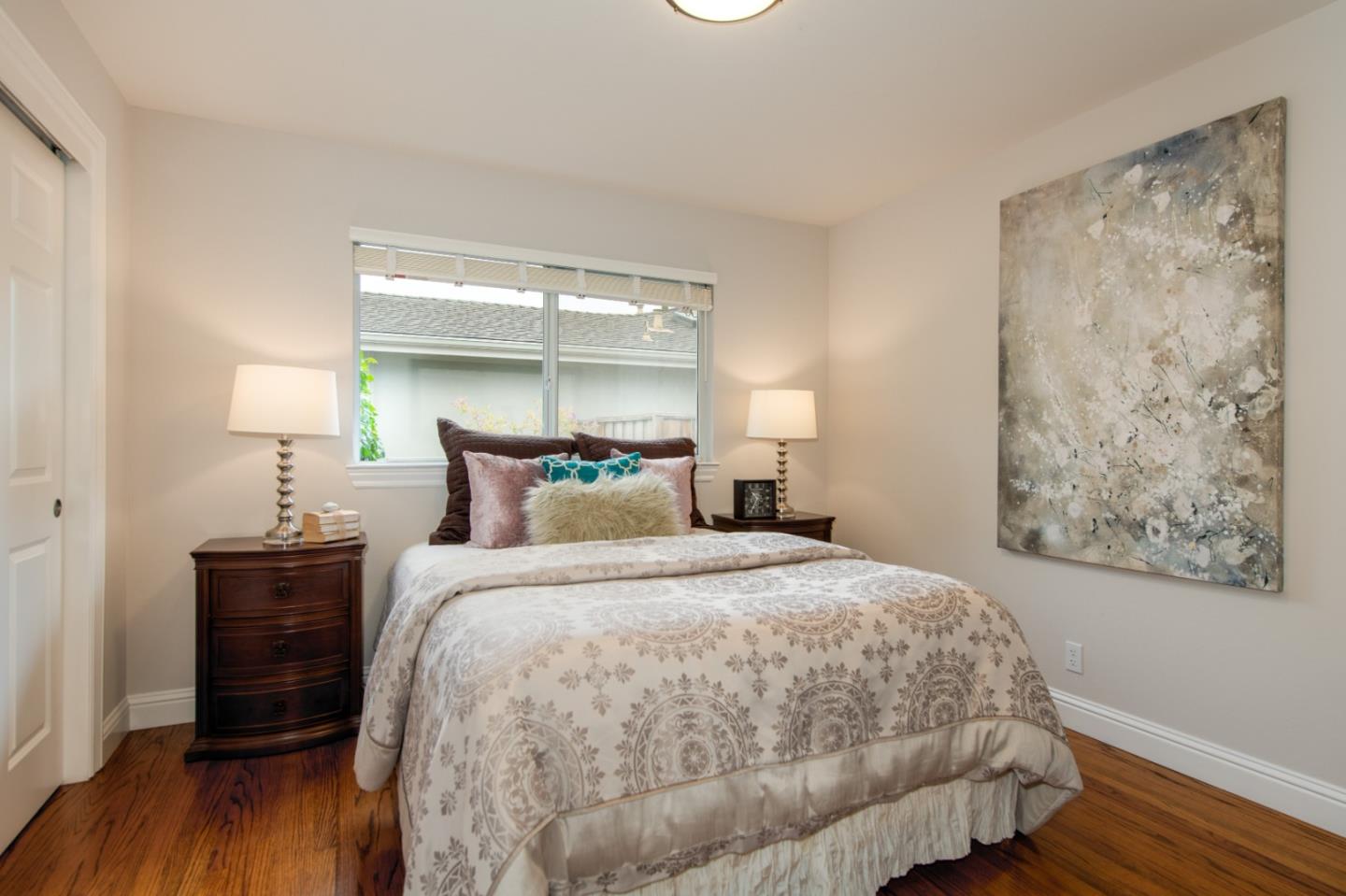 981 Thatcher Drive Los Altos, CA 94024 - Photo 17 of 30 a bedroom with a bed and wooden floor