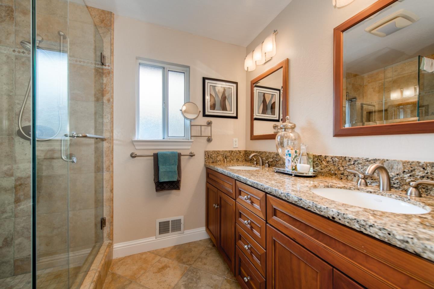 981 Thatcher Drive Los Altos, CA 94024 - Photo 20 of 30 a bathroom with double vanity sinks and a shower
