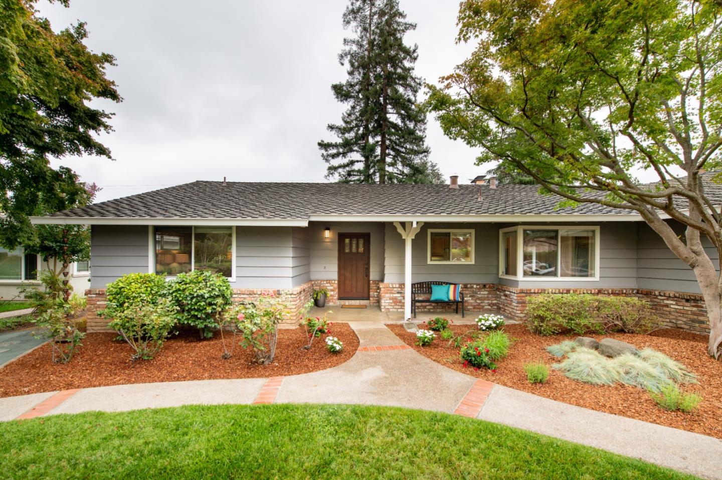 981 Thatcher Drive Los Altos, CA 94024 - Photo 2 of 30 a front view of a house with yard patio and green space