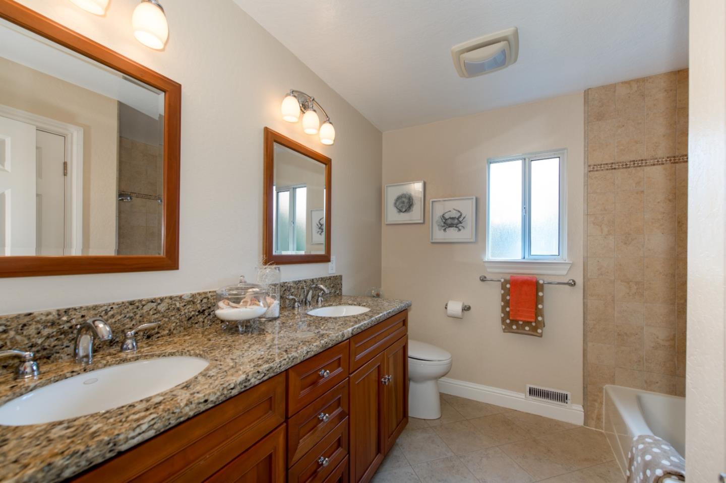 981 Thatcher Drive Los Altos, CA 94024 - Photo 21 of 30 a bathroom with a granite countertop double vanity sink mirror and bathtub