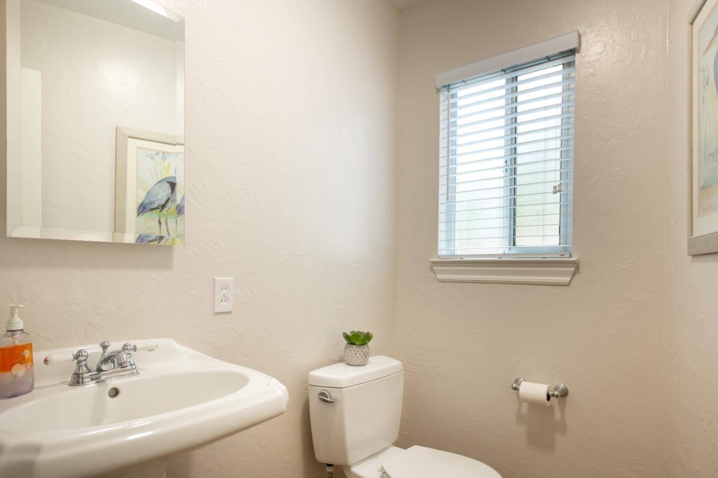 981 Thatcher Drive Los Altos, CA 94024 - Photo 22 of 30 a white toilet sitting next to a bathroom sink