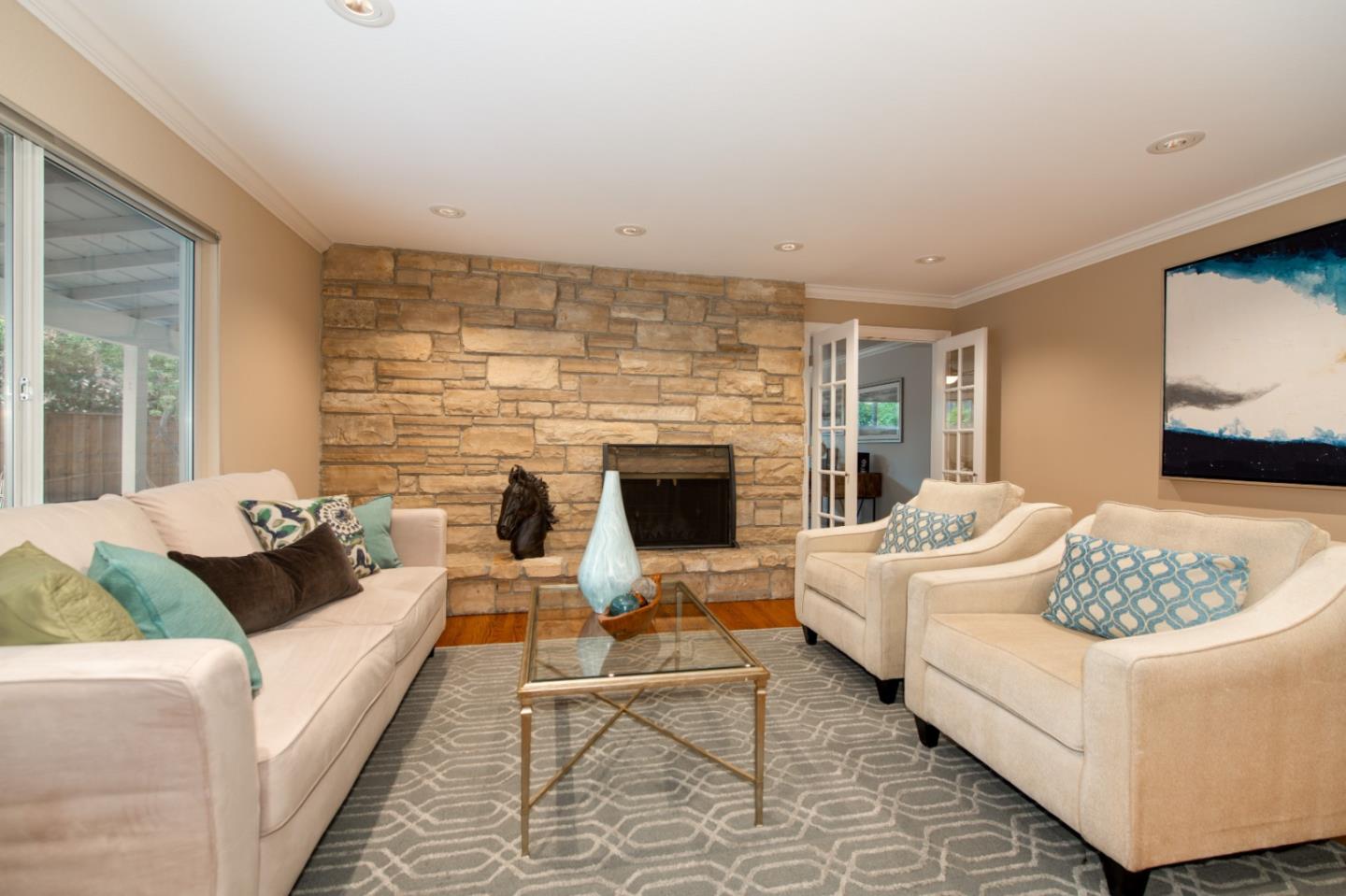 981 Thatcher Drive Los Altos, CA 94024 - Photo 8 of 30 a living room with furniture fireplace and a flat screen tv