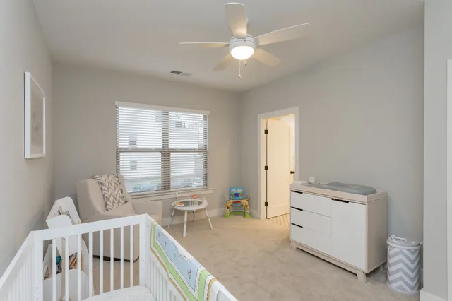 a bedroom with furniture and windows