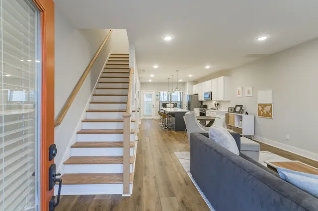 a view of a kitchen with furniture and staircase