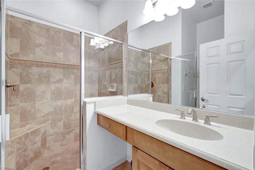 9508 Ironstone Terrace, Unit 201 Naples, FL 34120 - Photo 25 of 45 Full bath with a stall shower and vanity