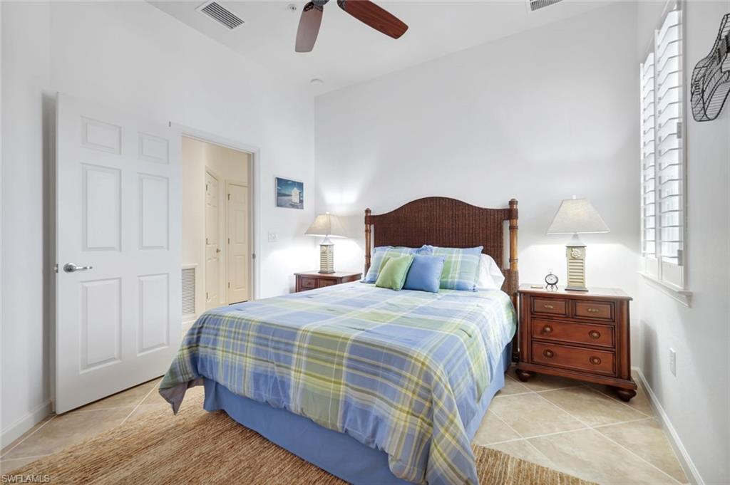 9508 Ironstone Terrace, Unit 201 Naples, FL 34120 - Photo 26 of 45 Bedroom with ceiling fan and light tile patterned flooring