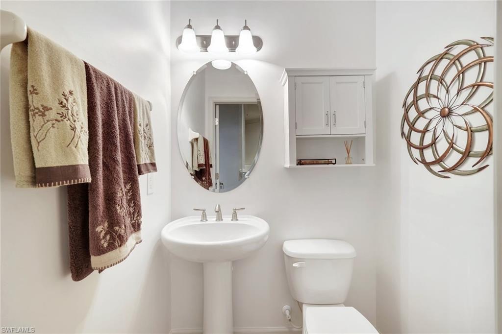 9508 Ironstone Terrace, Unit 201 Naples, FL 34120 - Photo 27 of 45 Half bathroom featuring toilet