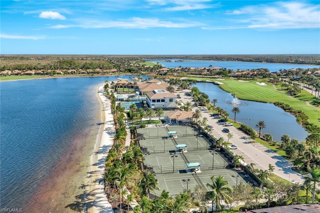 9508 Ironstone Terrace, Unit 201 Naples, FL 34120 - Photo 40 of 45 Aerial view of residential area with a large body of water