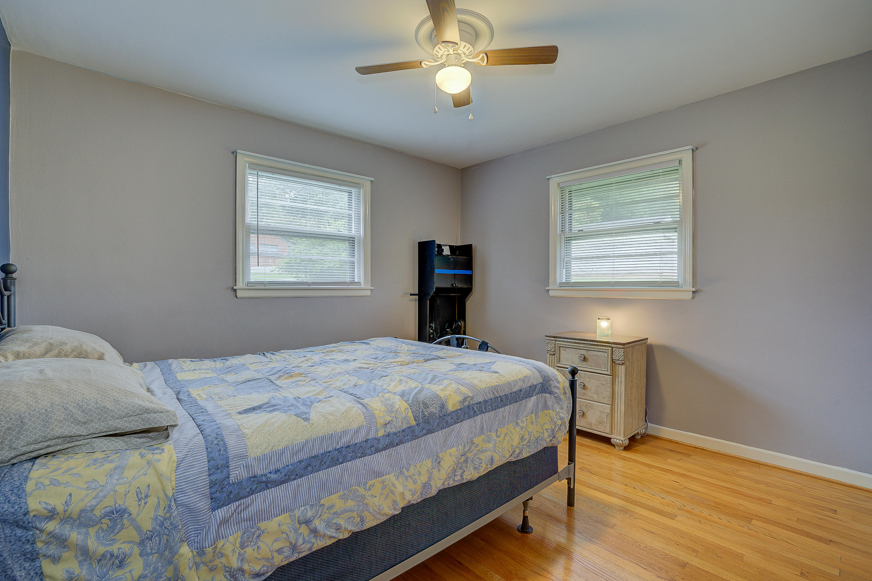 6147 Cove Road Roanoke, VA 24019 - Photo 15 of 16 a bedroom with a bed and a chandelier