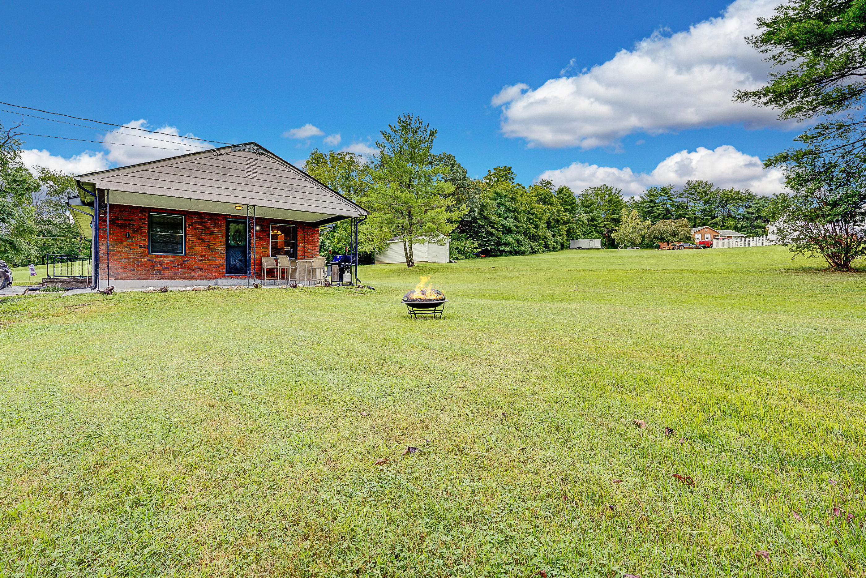 6147 Cove Road Roanoke, VA 24019 - Photo 3 of 16 a view of a house with pool and a yard
