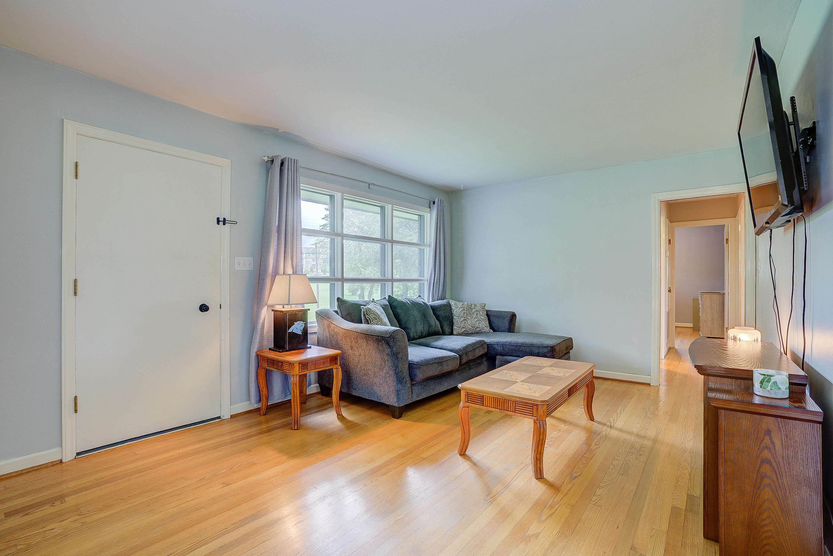 6147 Cove Road Roanoke, VA 24019 - Photo 5 of 16 a living room with furniture and a flat screen tv