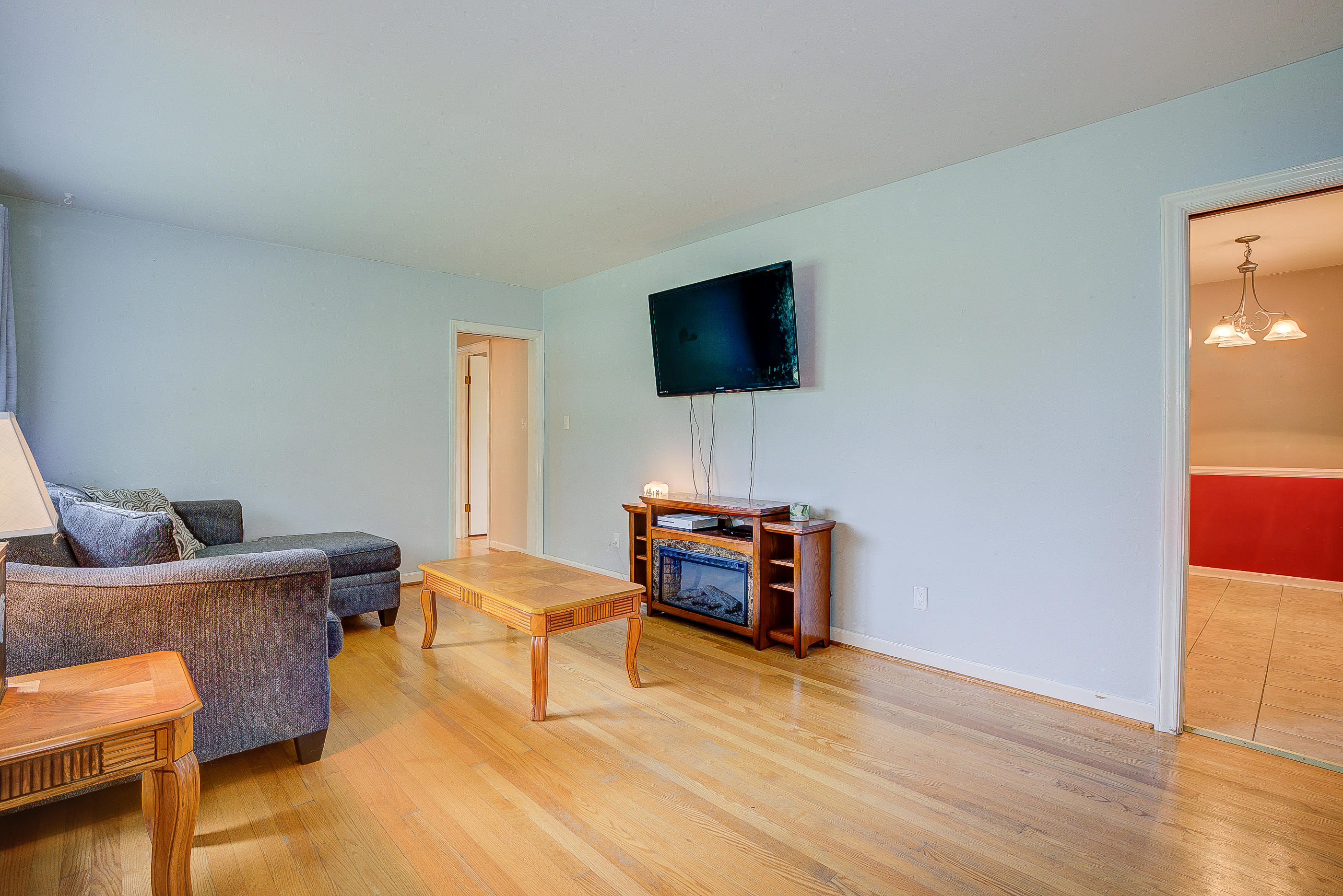 6147 Cove Road Roanoke, VA 24019 - Photo 7 of 16 a living room with furniture and a flat screen tv