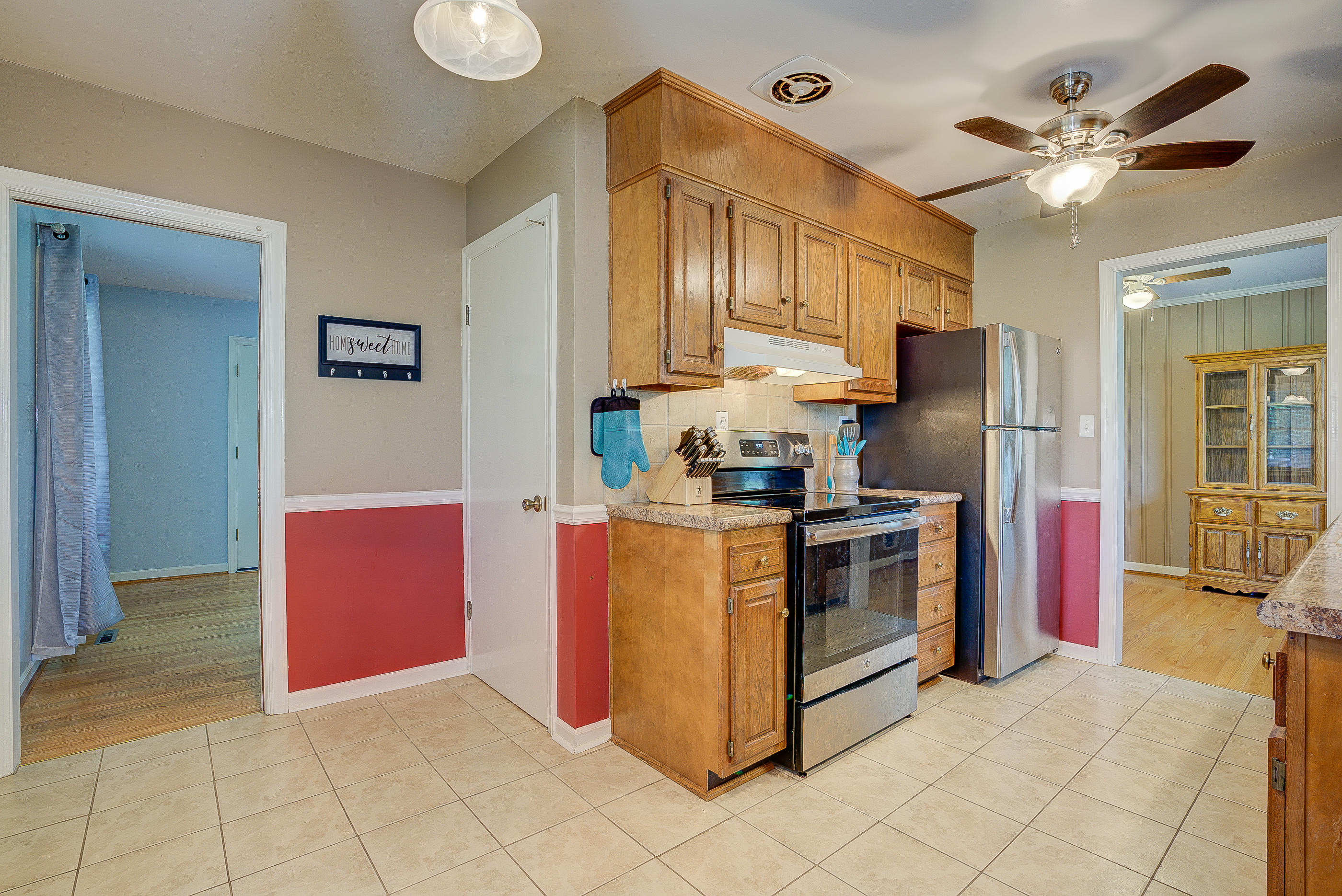 6147 Cove Road Roanoke, VA 24019 - Photo 8 of 16 a kitchen with stainless steel appliances granite countertop a stove a sink and a refrigerator