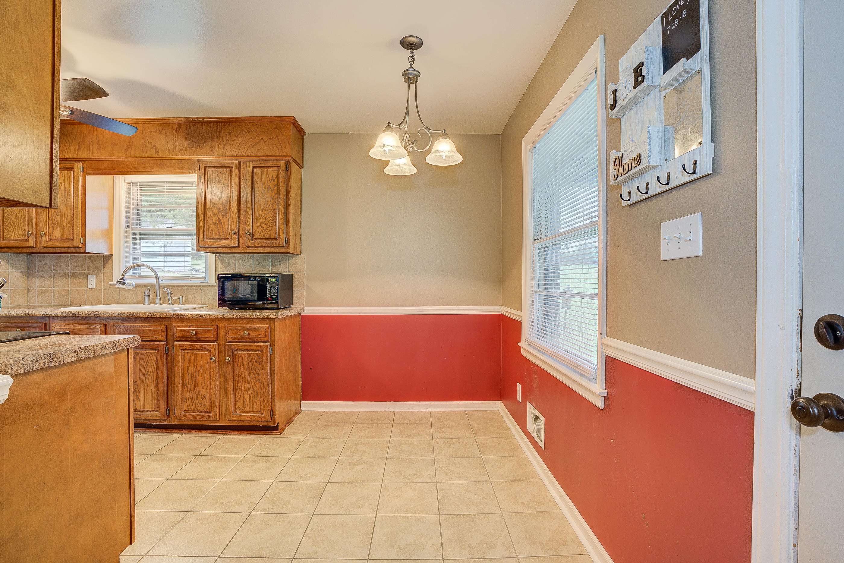 6147 Cove Road Roanoke, VA 24019 - Photo 9 of 16 a kitchen with granite countertop a stove a sink and dishwasher
