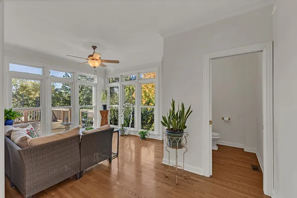 a bathroom with a granite countertop shower and a toilet