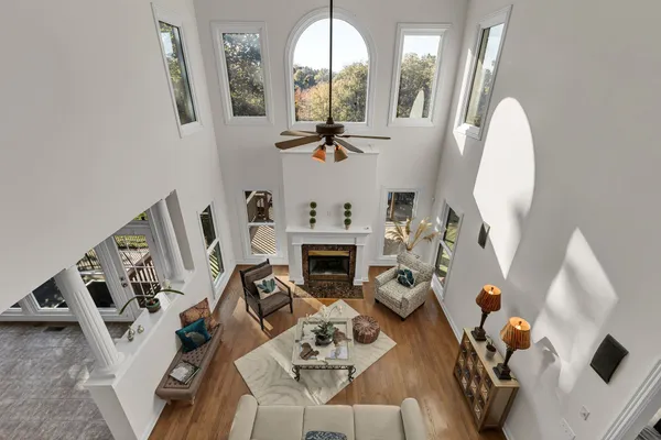 a white toilet sitting next to a bath tub