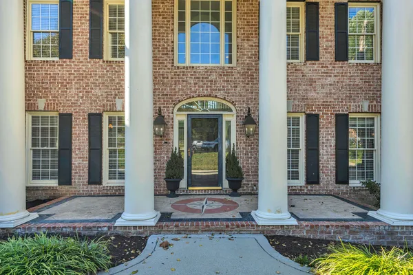 a view of entryway and hall with dining room