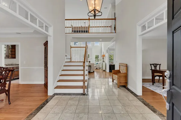 a view of an entryway with wooden floor