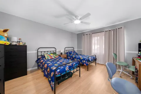 a bed room with two bed and a couch