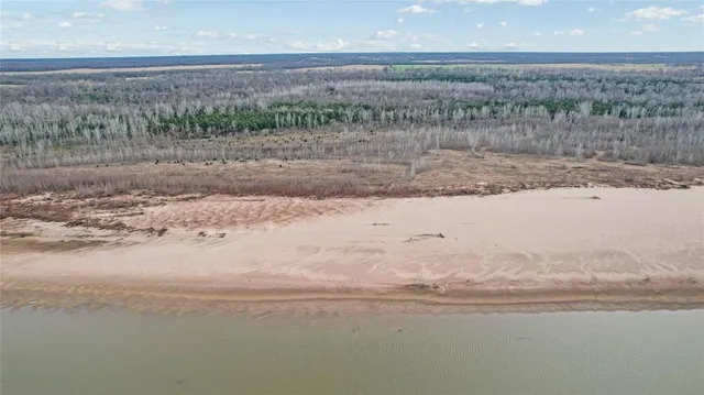 a view of a lake view and covered with trees