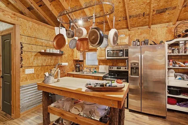 a kitchen with a sink and refrigerator