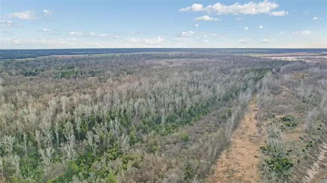 a view of an empty room and mountain view