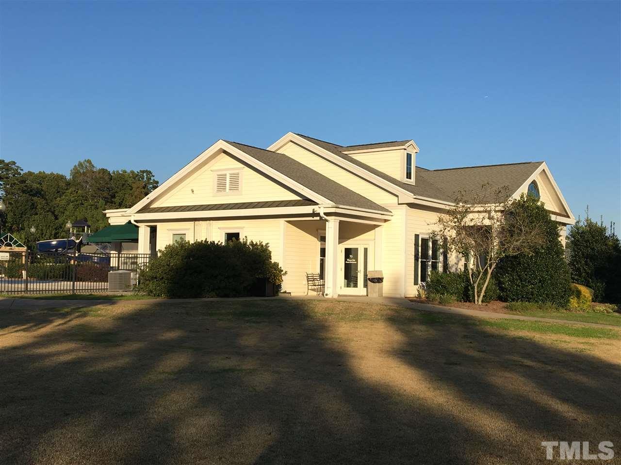 12223 Fox Valley Street Raleigh, NC 27614 - Photo 22 of 25 a view of a big house with a big yard and large trees