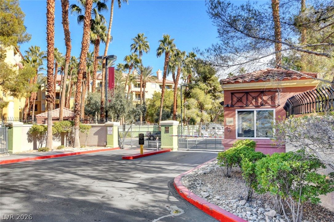 230 East Flamingo Road, Unit 106 Las Vegas, NV 89169 - Photo 37 of 66 A secure, gated entry invites residents into this palm-lined community.