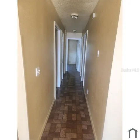 a view of a hallway with a glass door