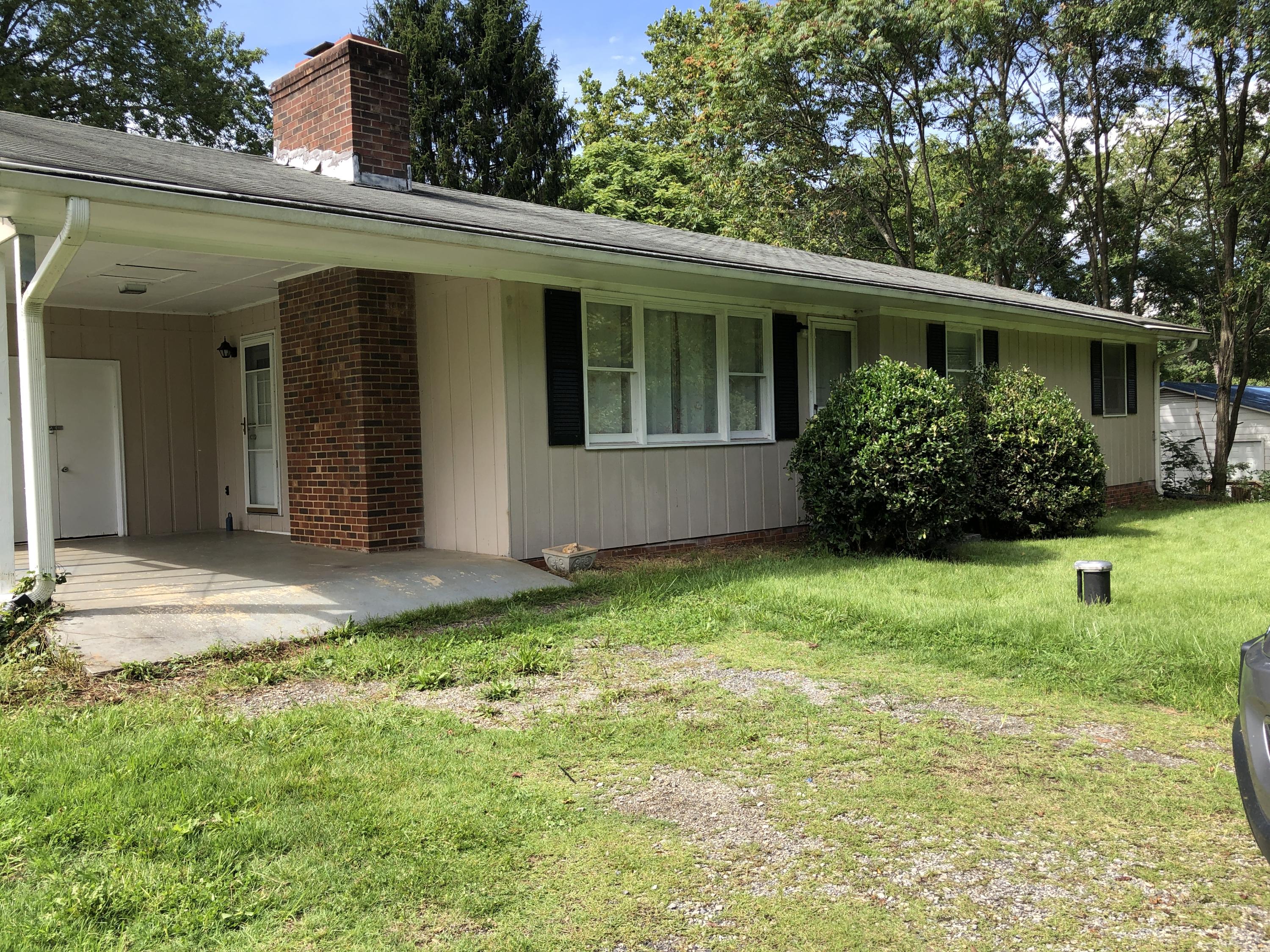 1325 Iron Ridge Road Rocky Mount, VA 24151 - Photo 4 of 17 a view of a house with a backyard