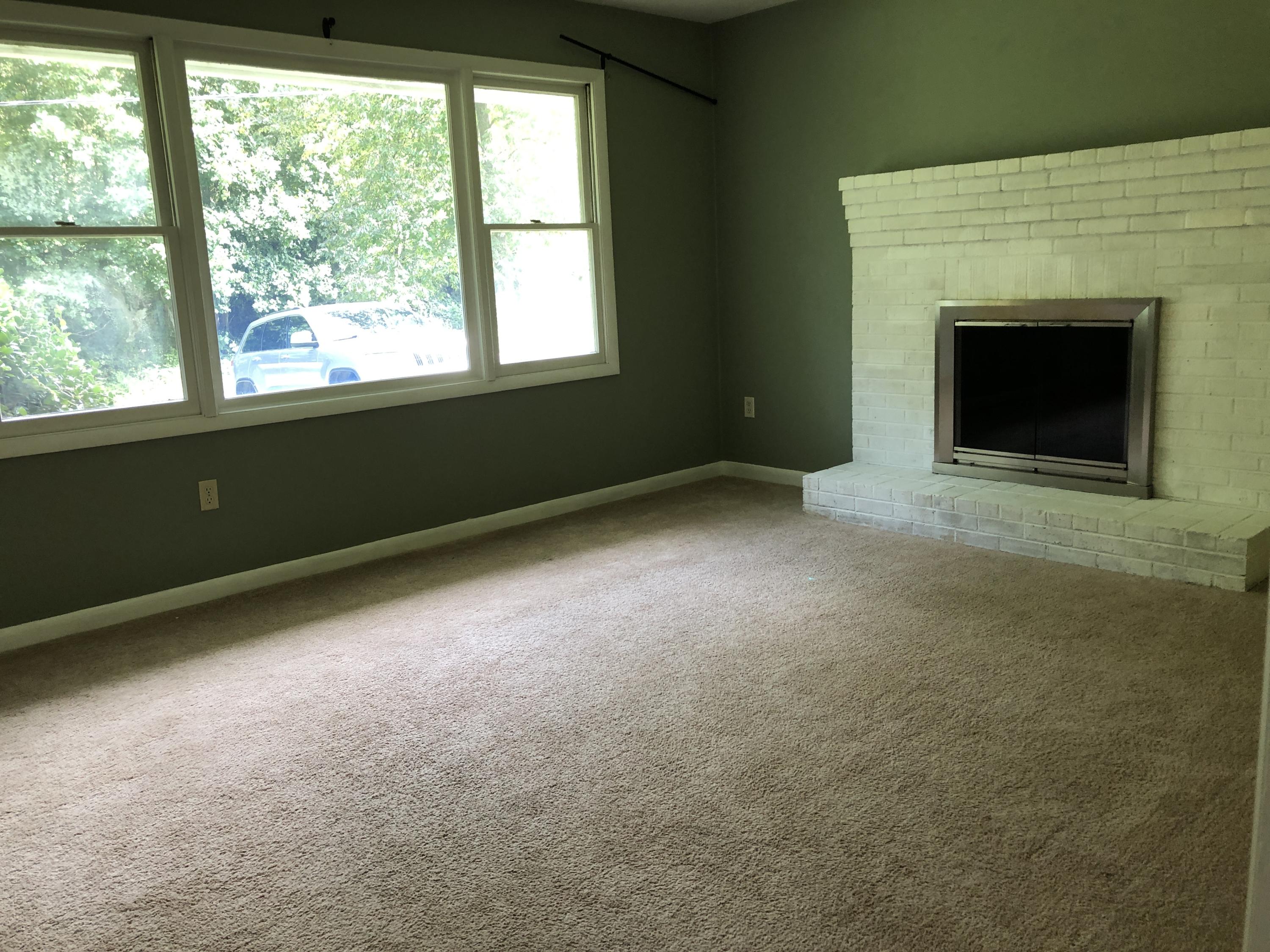 1325 Iron Ridge Road Rocky Mount, VA 24151 - Photo 6 of 17 a view of an empty room with a fireplace