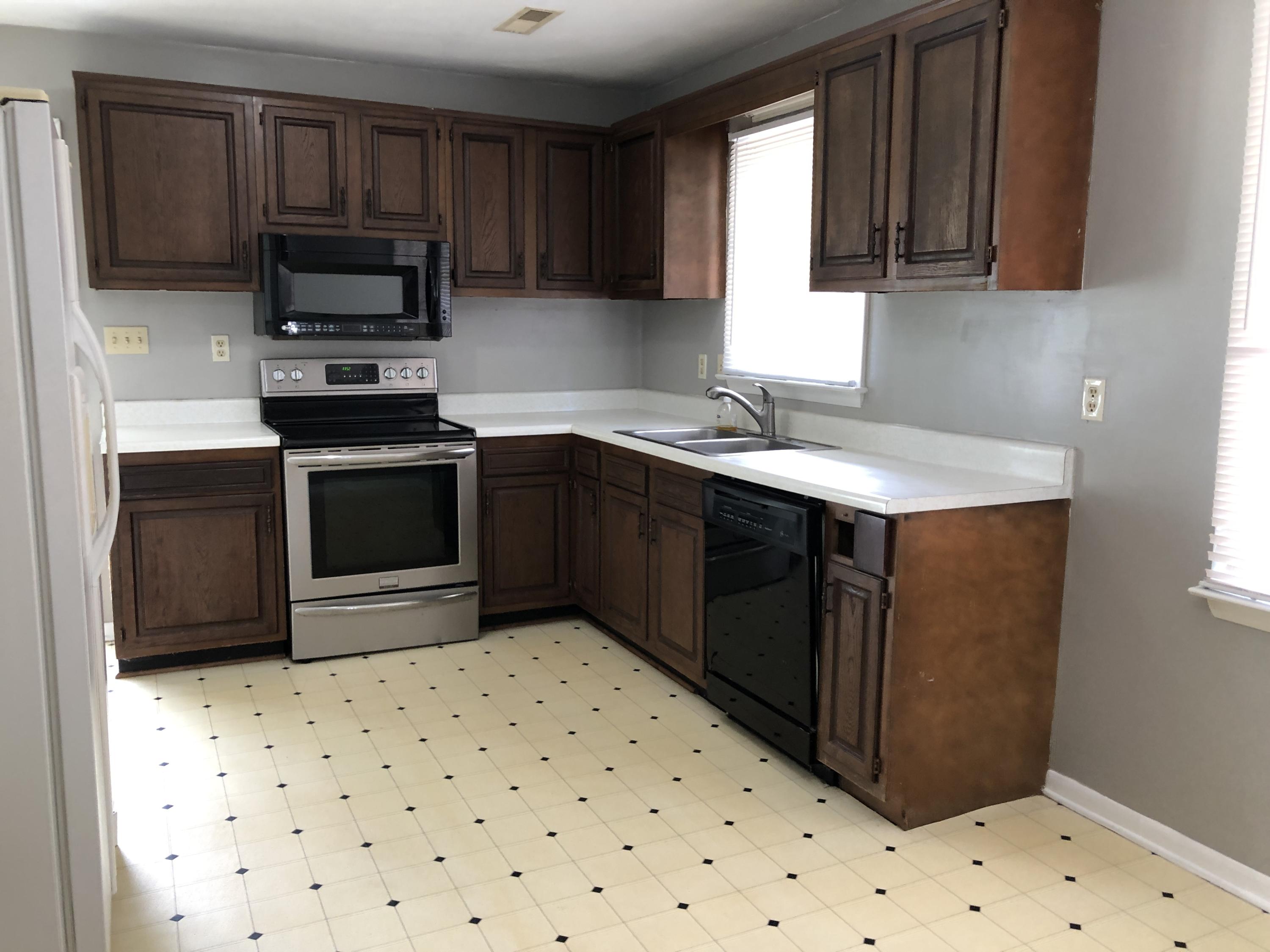 1325 Iron Ridge Road Rocky Mount, VA 24151 - Photo 9 of 17 a kitchen with a sink a stove top oven and a refrigerator