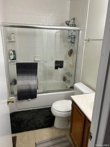a bathroom with a sink a toilet a shower and a mirror