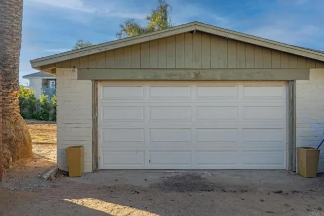 a front view of a house with wooden stairs