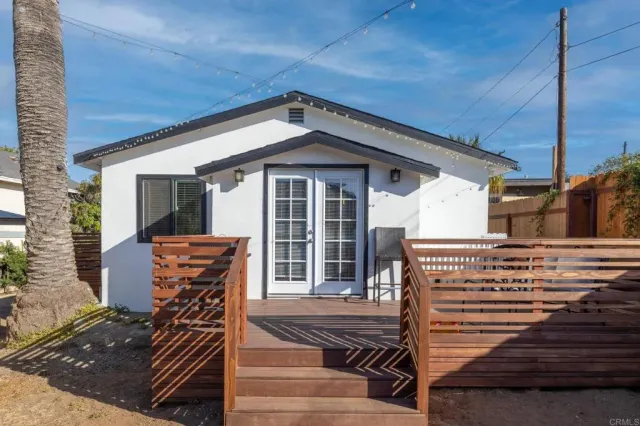 a view of a house with wooden floor and a balcony