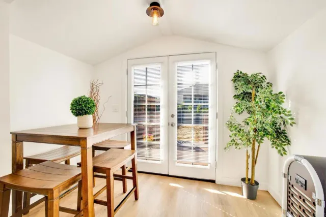a bedroom with a bed and a potted plant
