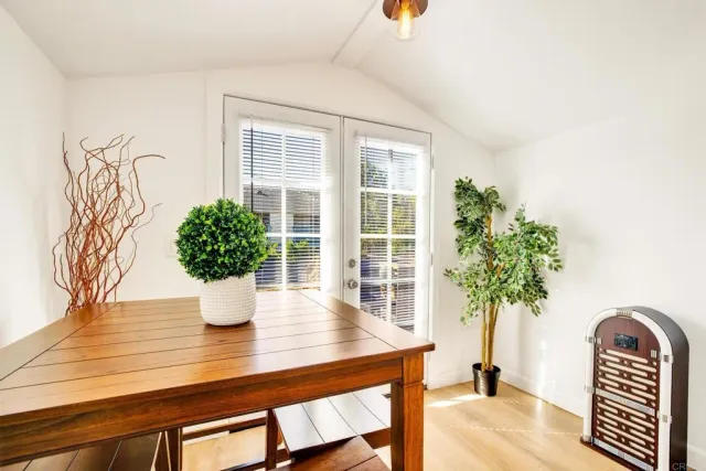 a bedroom with a large bed and a window