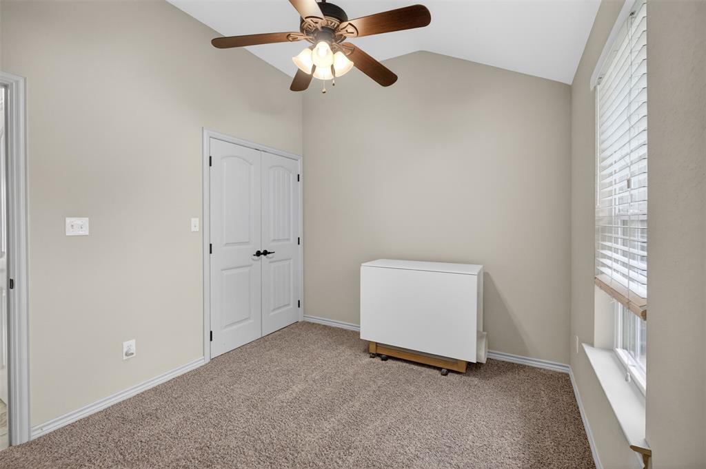 505 East 5th Street Springtown, TX 76082 - Photo 25 of 39 an empty room with windows and fan