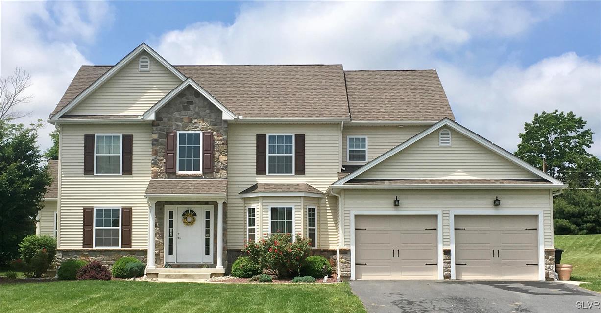 146 Fox Ridge Nazareth, PA 18064 - Photo 1 of 24 a front view of a house with a yard and garage