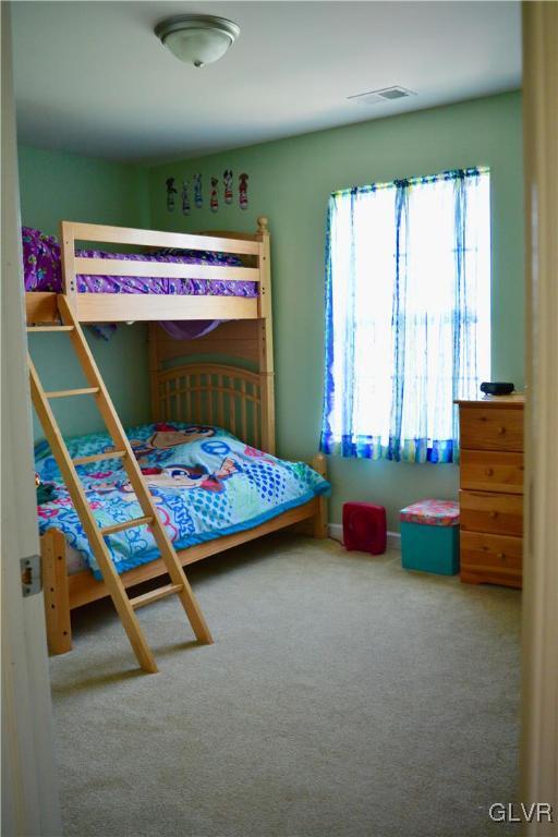 146 Fox Ridge Nazareth, PA 18064 - Photo 20 of 24 a bedroom with a bed and large windows