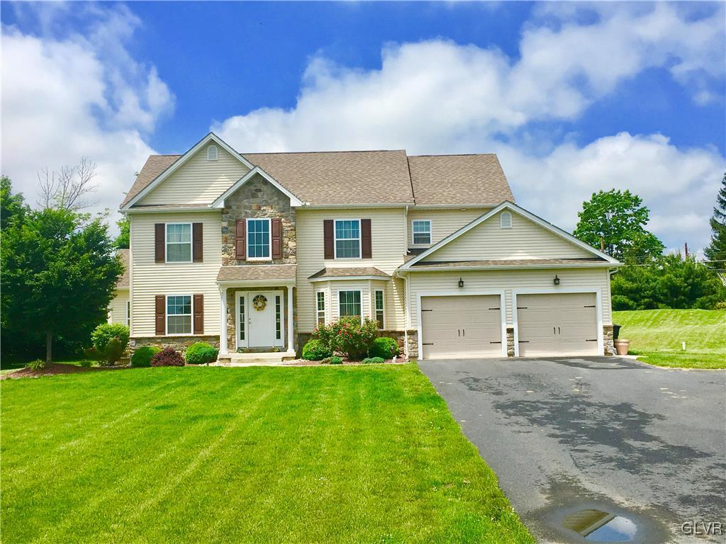 146 Fox Ridge Nazareth, PA 18064 - Photo 3 of 24 a front view of a house with a yard and trees